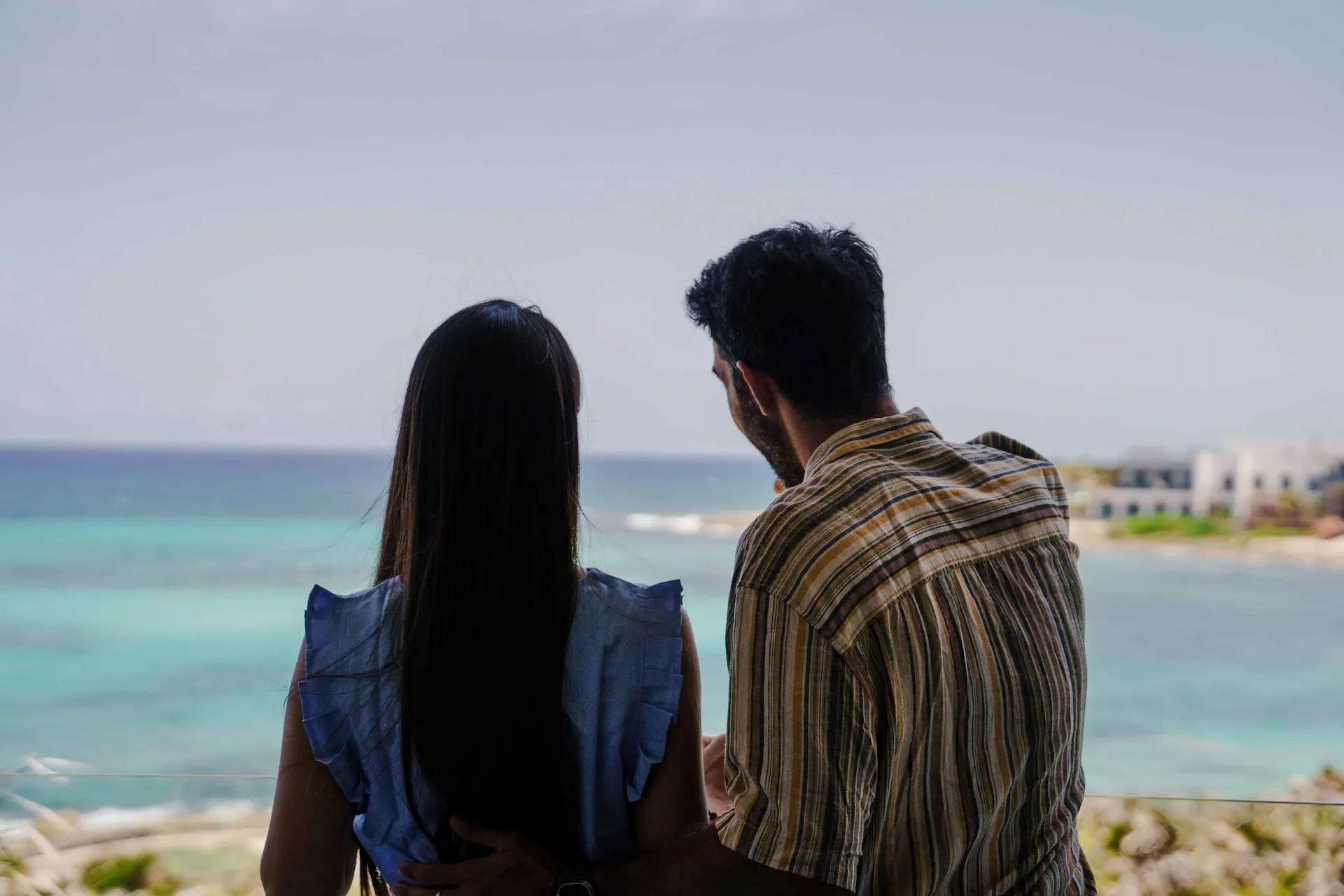 Couple admiring the views from their room balcony