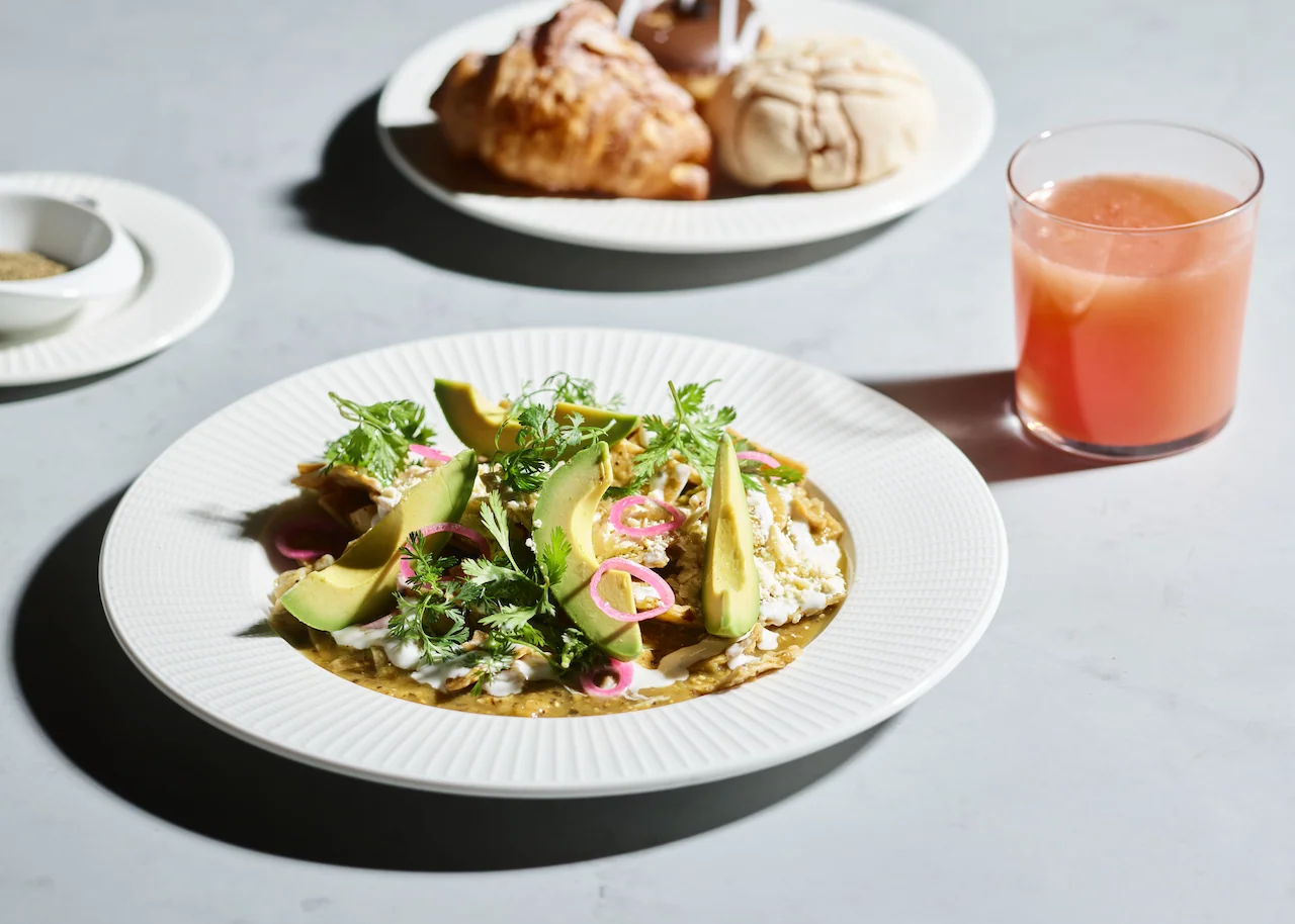 Breakfast with chilaquiles, avocado, pastries, and fresh fruit juice at Conrad Tulum Riviera Maya hotel