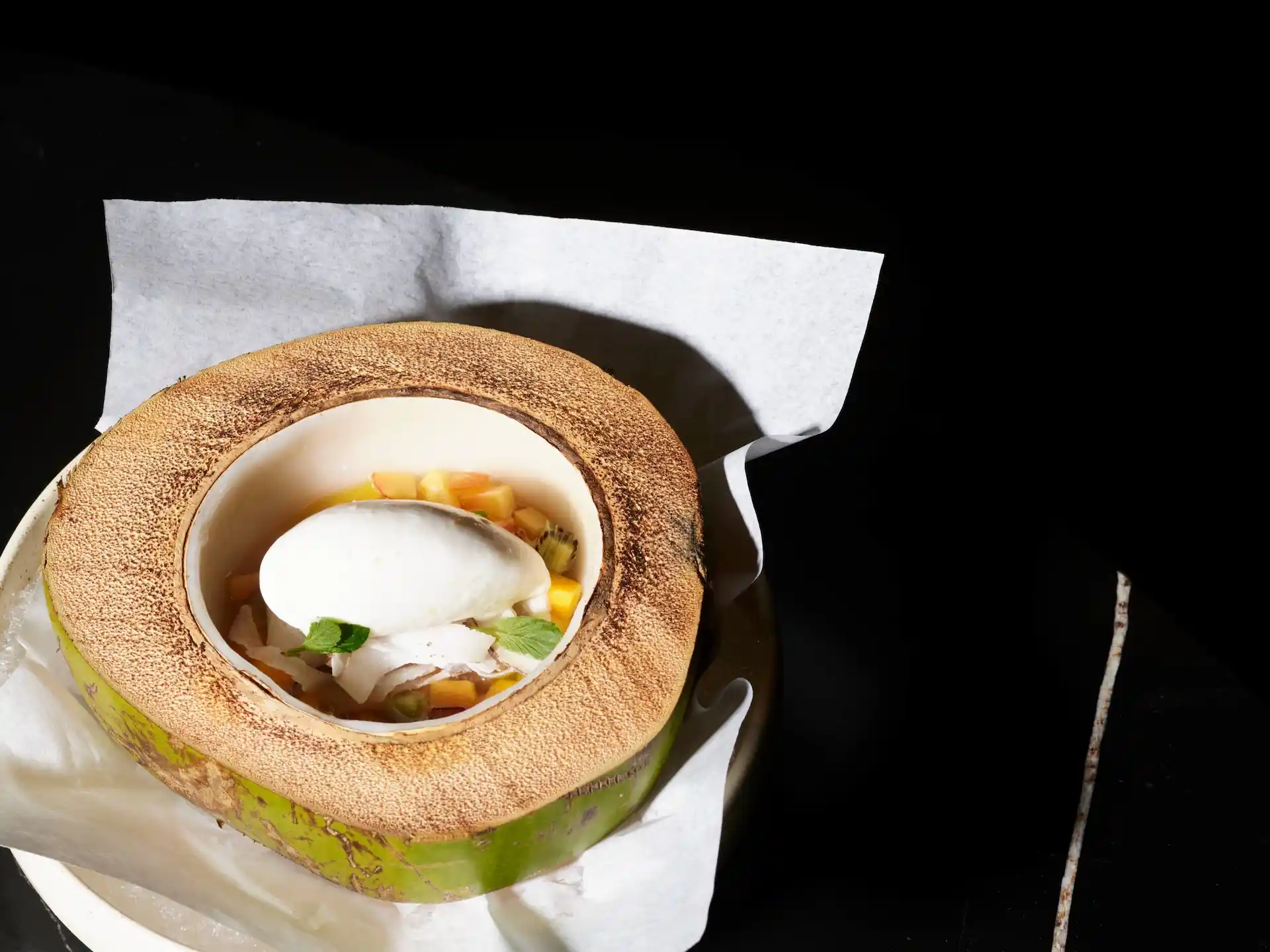 Mexican food served in a coconut at Autor restaurant