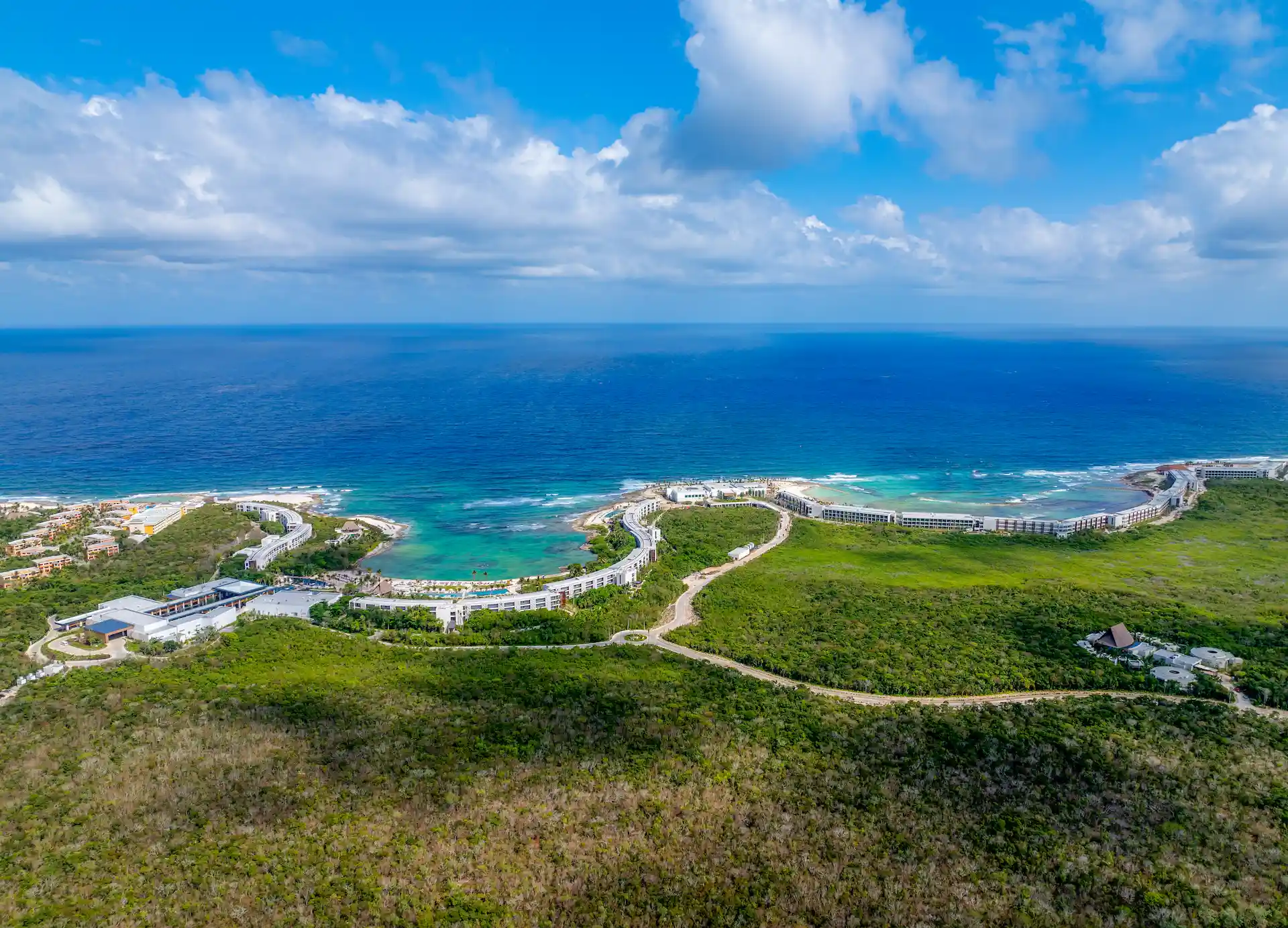 Aerial view of the lush vegetation surrounding Conrad Tulum, showcasing the natural beauty and serenity of the landscape