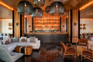 Stylish interior of Chaak Bar at Conrad Tulum Riviera Maya featuring contemporary decor and a relaxed atmosphere