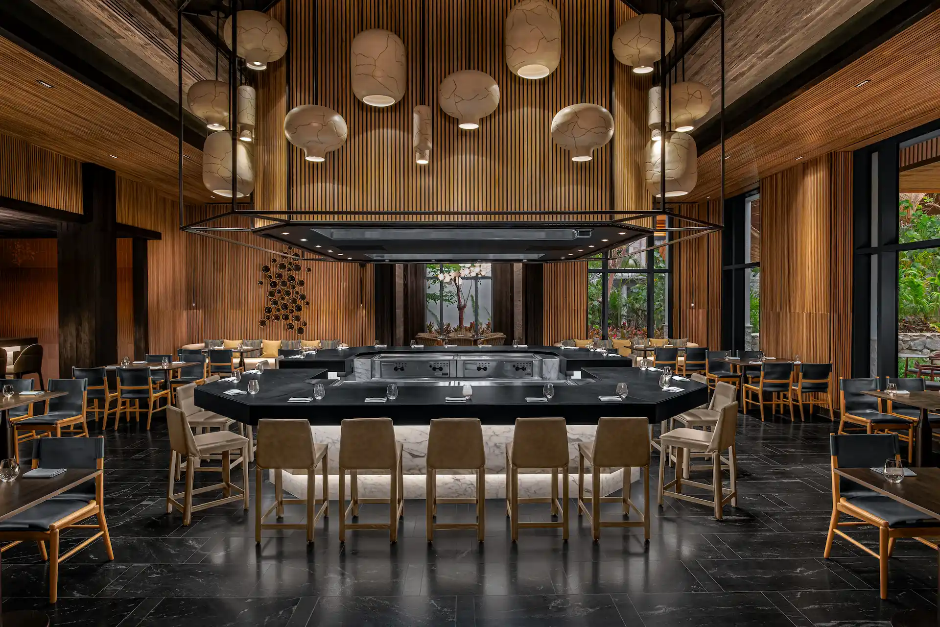 The interior of the Kengai restaurant featuring a circular bar and stylish decor