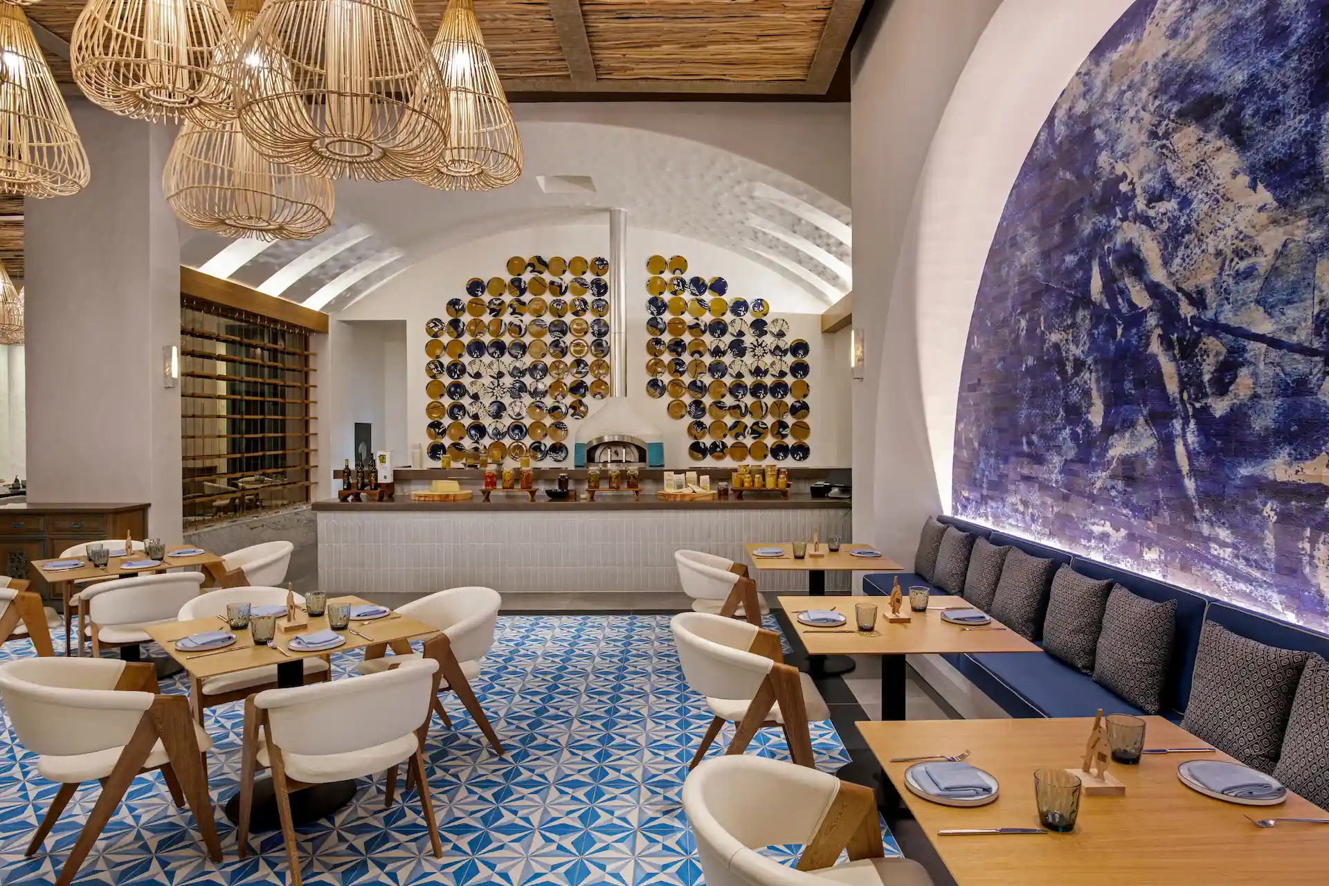 Interior design of Maratea restaurant, showcasing modern decor and inviting ambiance at Conrad Tulum Riviera Maya