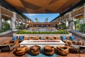 Vibrant terrace of Ultramar poolside bar at Conrad Tulum Riviera Maya Hotel featuring stylish seating