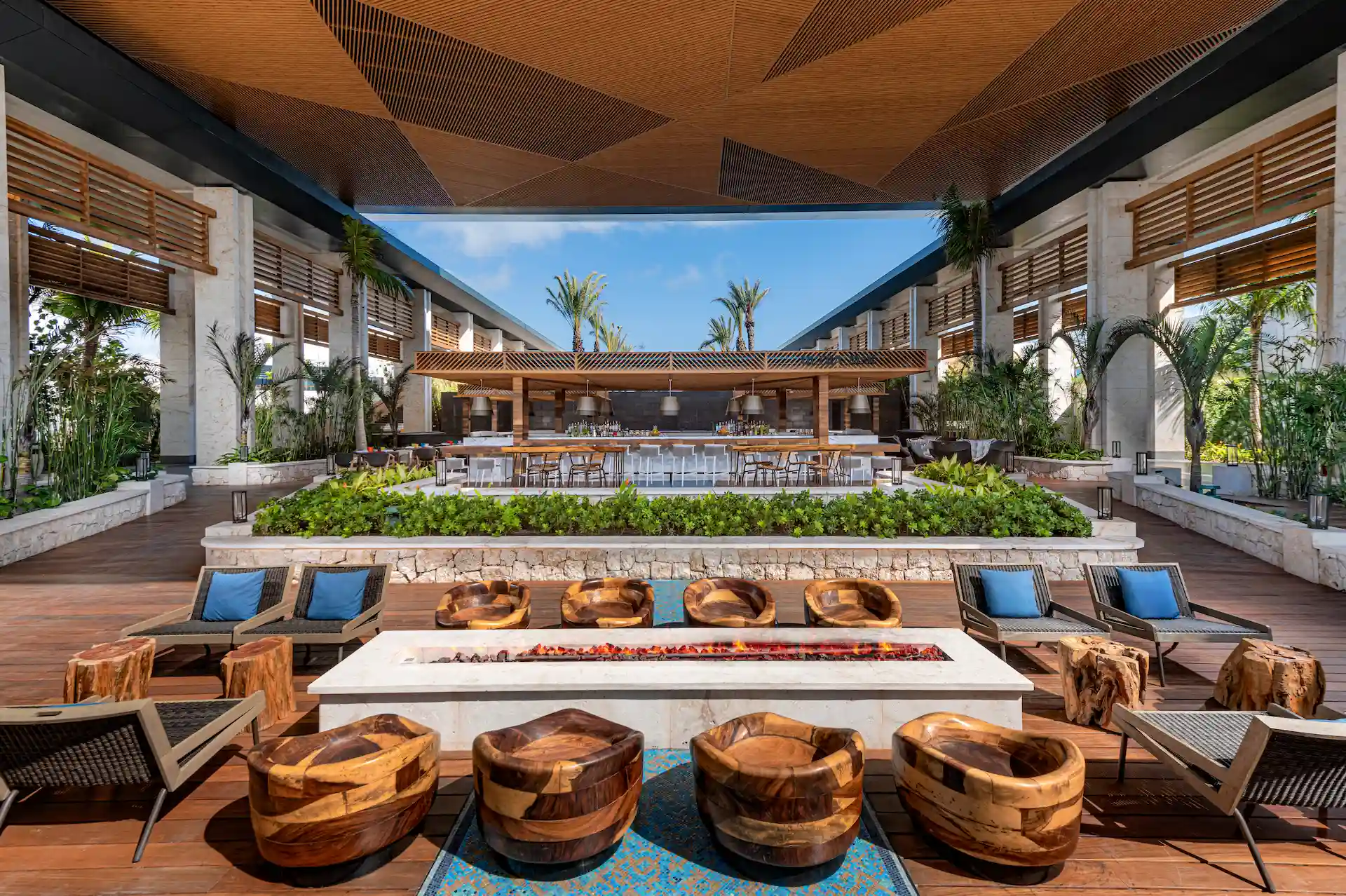 Vibrant terrace of Ultramar poolside bar at Conrad Tulum Riviera Maya Hotel featuring stylish seating