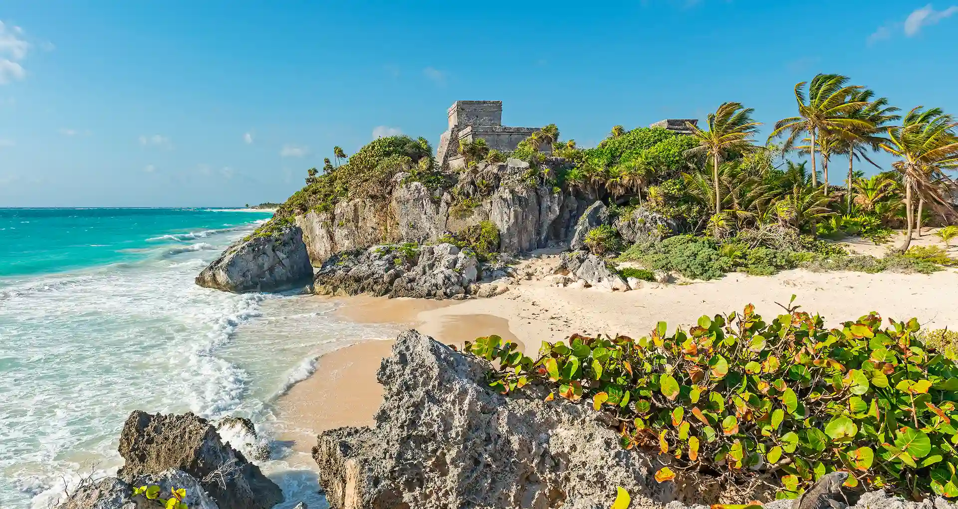 Beach in Tulum with soft white sand and crystal-clear turquoise waters