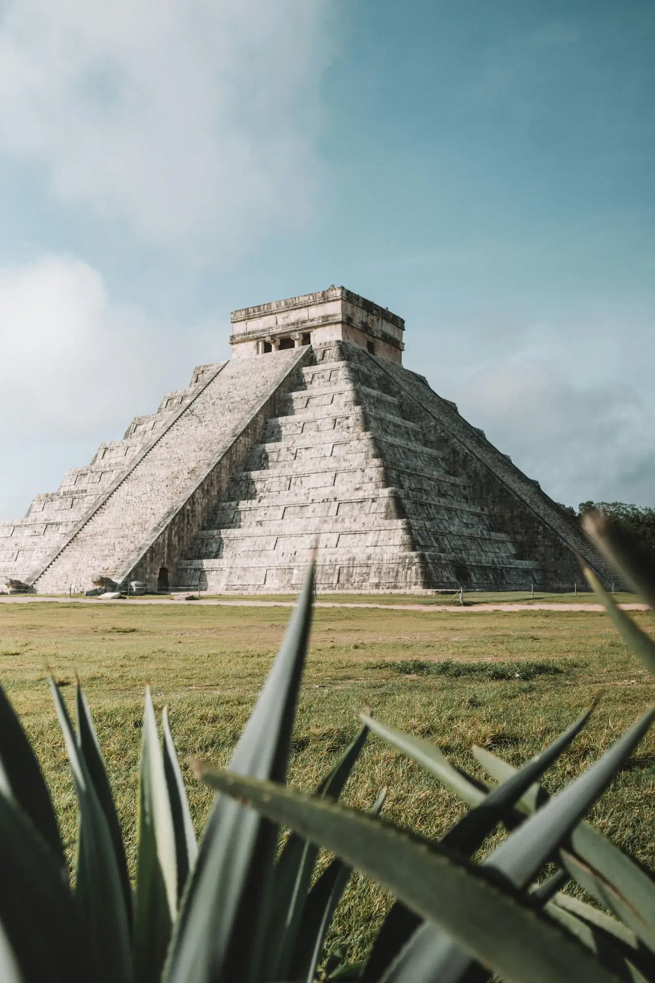 Mayan pyramid in Tulum surrounded by lush greenery