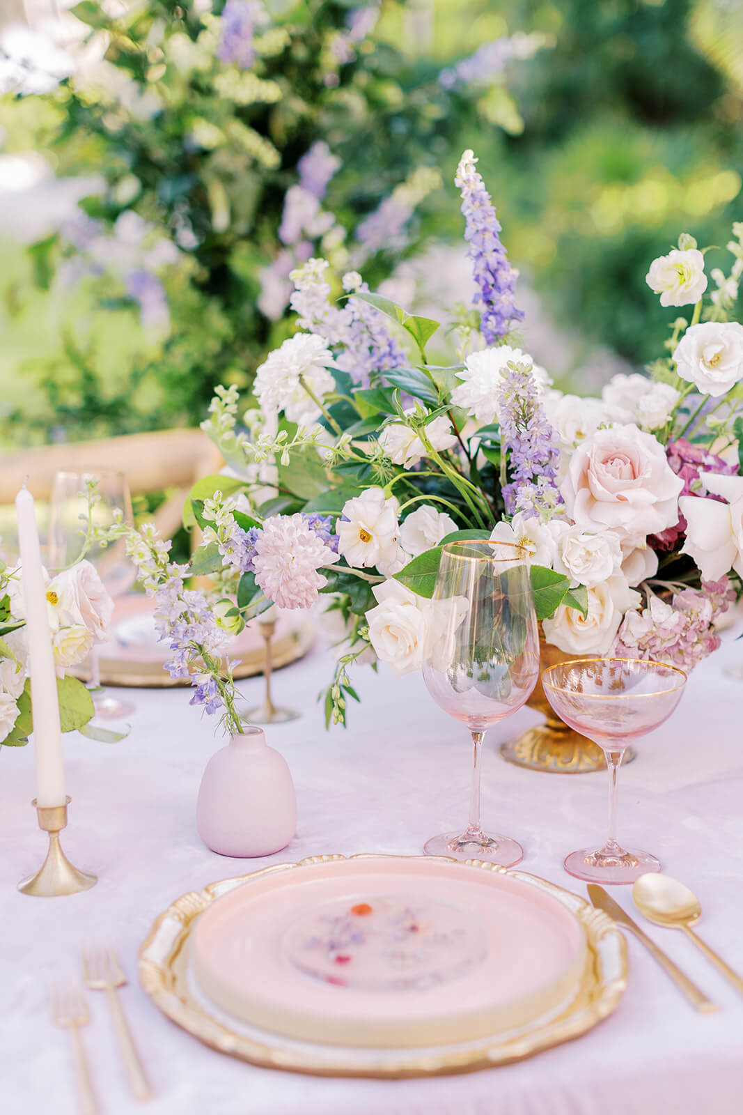 Table set with elegant silverware and flowers for a wedding at Conrad Tulum Riviera Maya, featuring a sophisticated and romantic setup