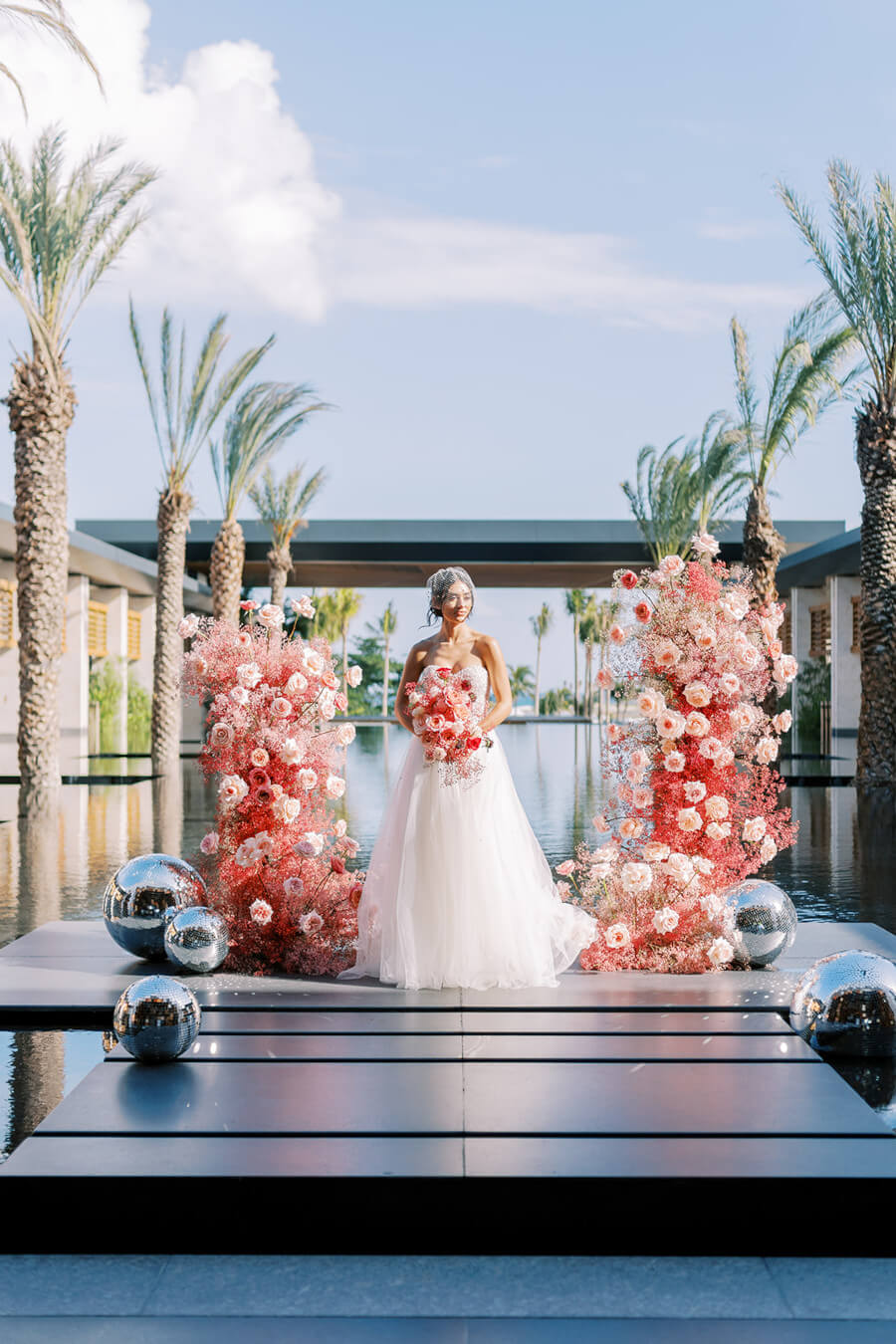 Woman standing at the altar on her wedding day at Conrad Tulum