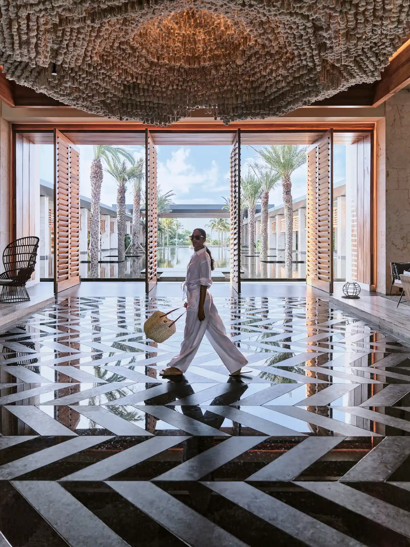 Woman arriving at the hotel lobby with her handbag