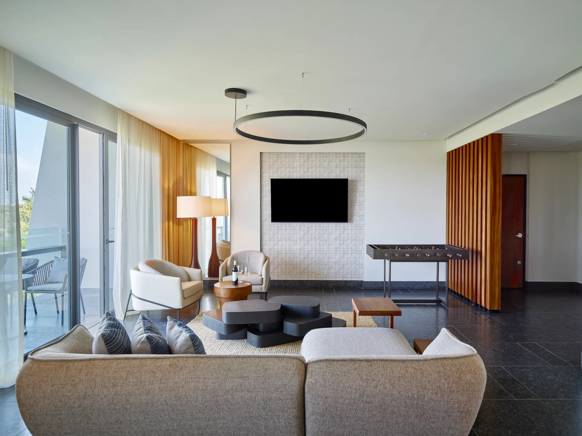 Interior of a Ceiba Club room at Conrad Tulum, featuring modern decor, a comfortable bed, and luxurious amenities