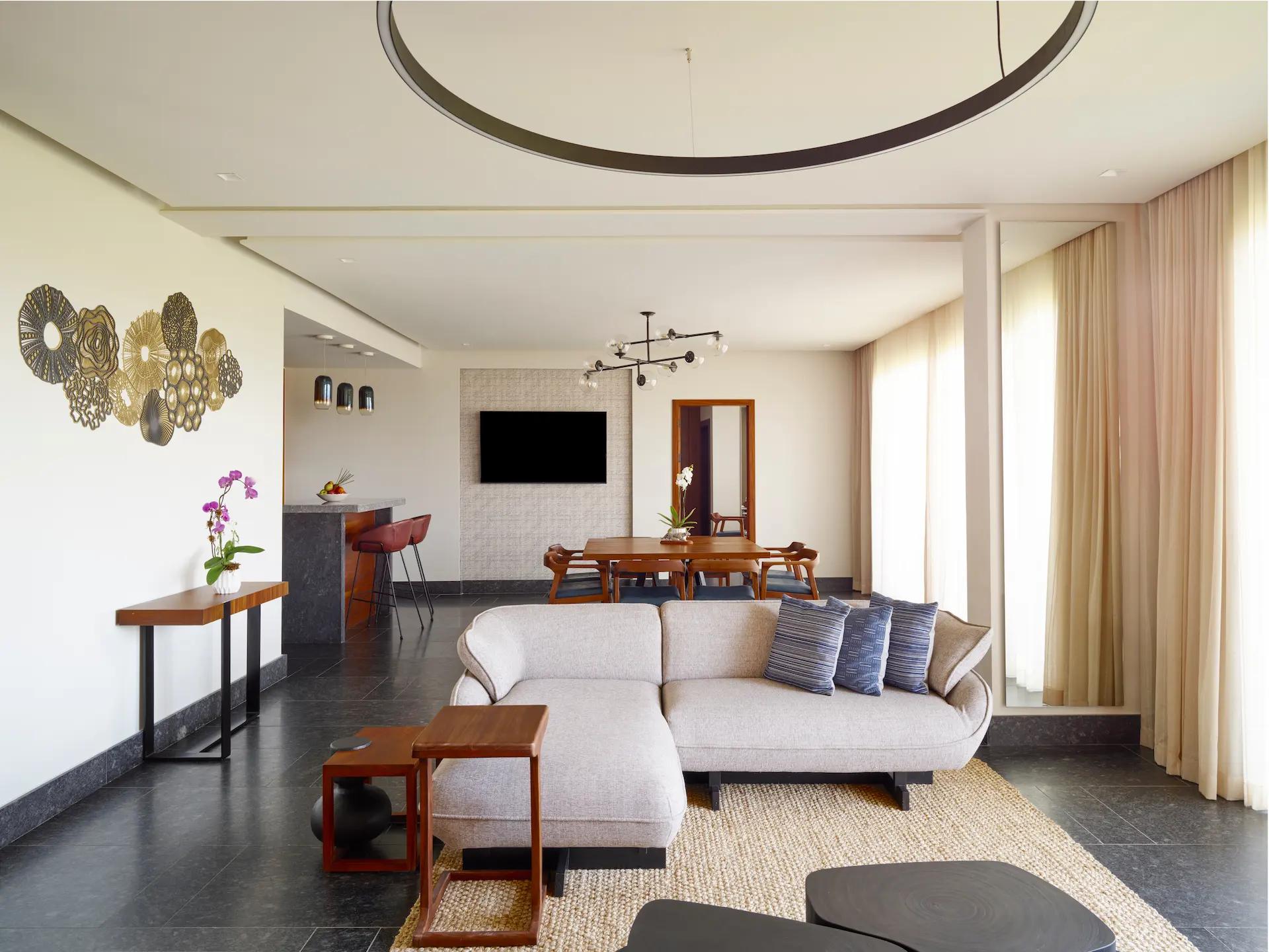 Interior of a Ceiba Club room at Conrad Tulum Riviera Maya, showcasing upscale design, luxurious furnishings, and serene atmosphere.