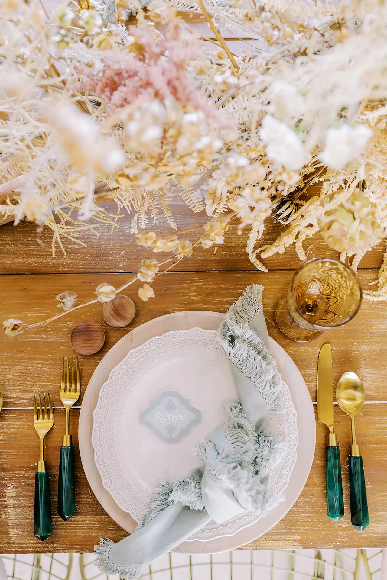 Beautifully arranged plate on a wedding table at Conrad Tulum, complemented by elegant cutlery and decorative accents