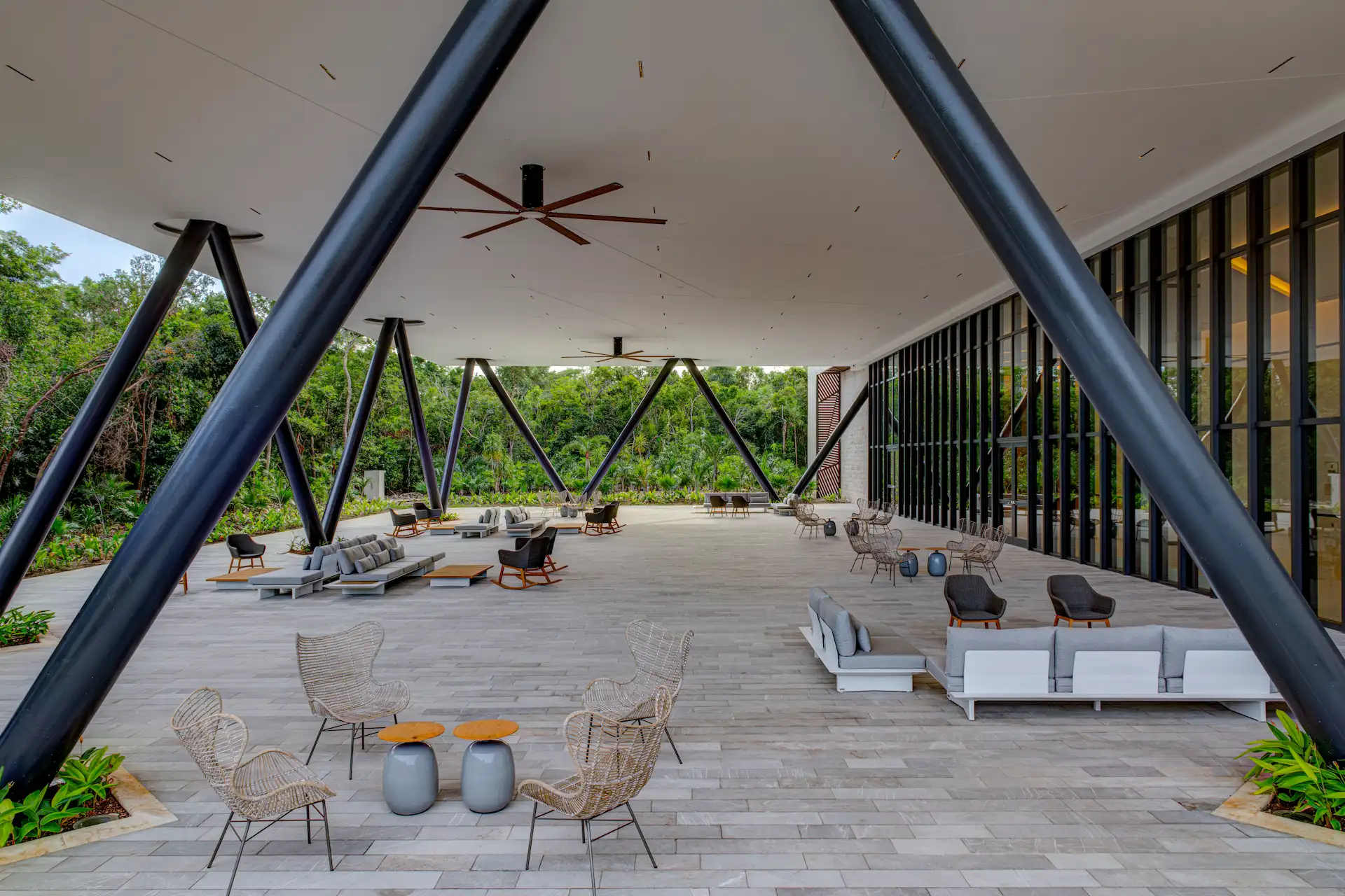 Stylish exterior of the Tulkal Convention Center at Conrad Tulum, surrounded by lush landscaping