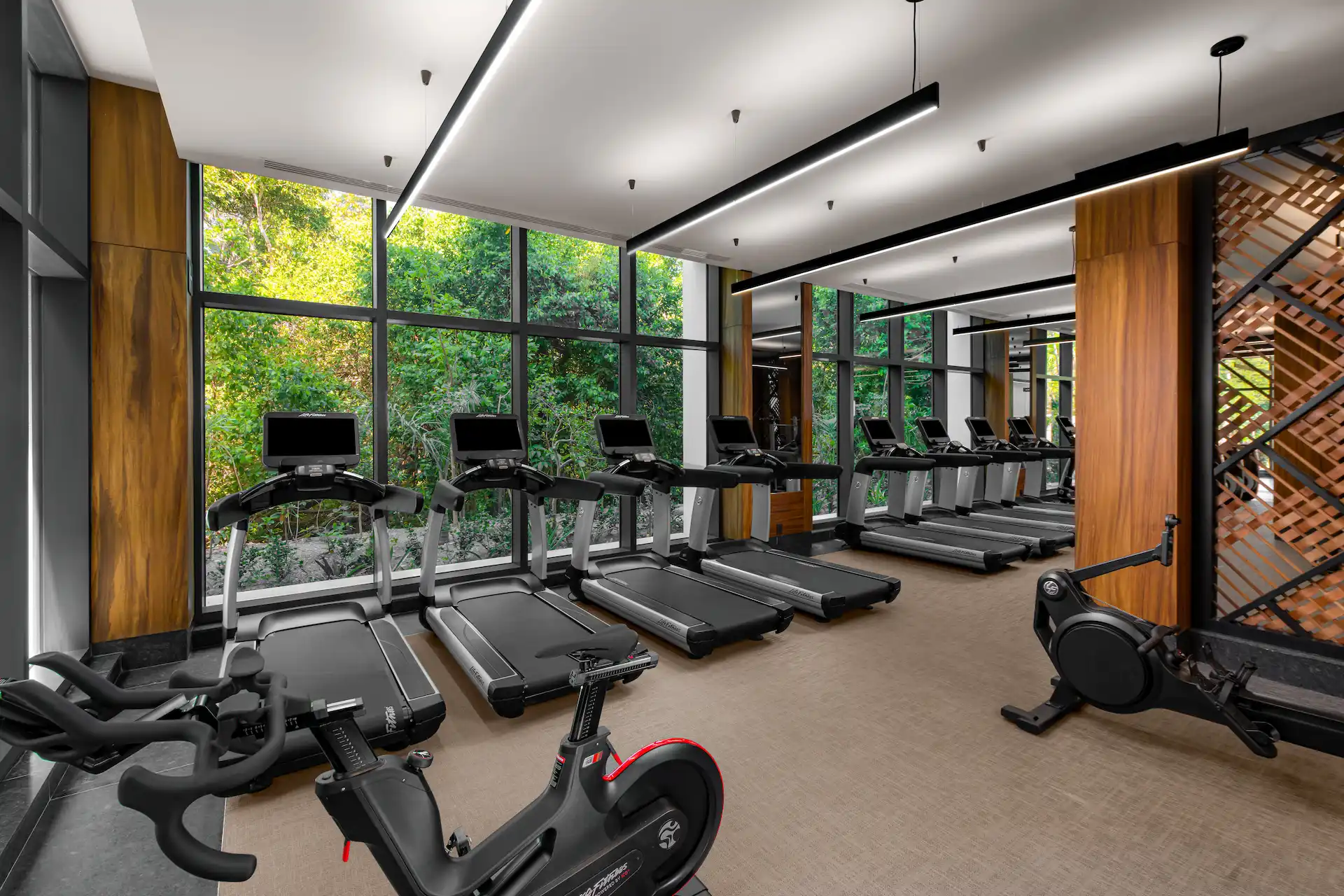 Hotel gym featuring modern equipment and spacious workout areas, designed for fitness enthusiasts