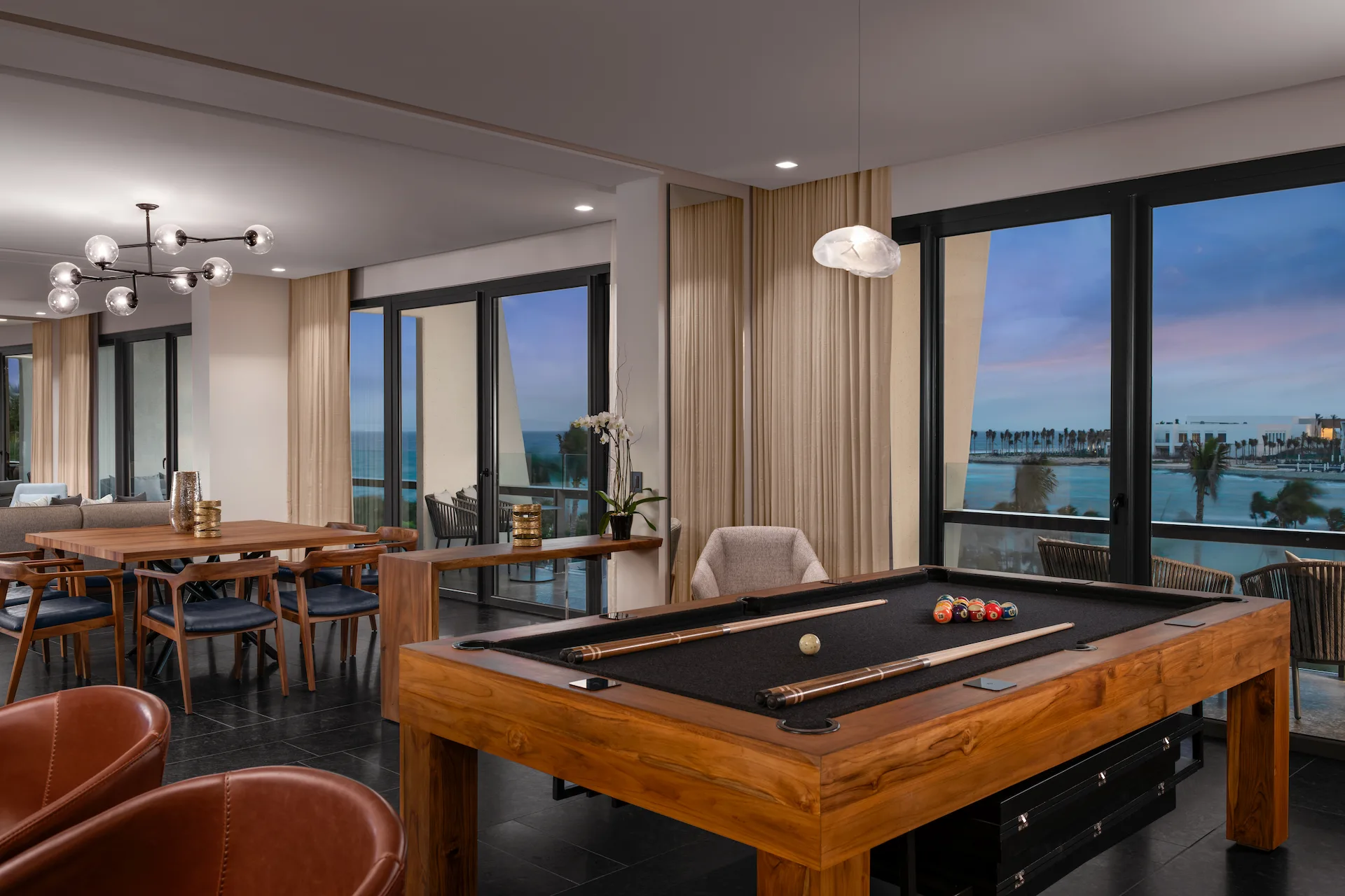 Luxurious interior of the presidential suite at Conrad Tulum, showcasing a stylish billiard table and elegant decor