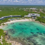 Aerial view of Conrad Tulum Riviera Maya hotel showcasing its architecture and lush surroundings