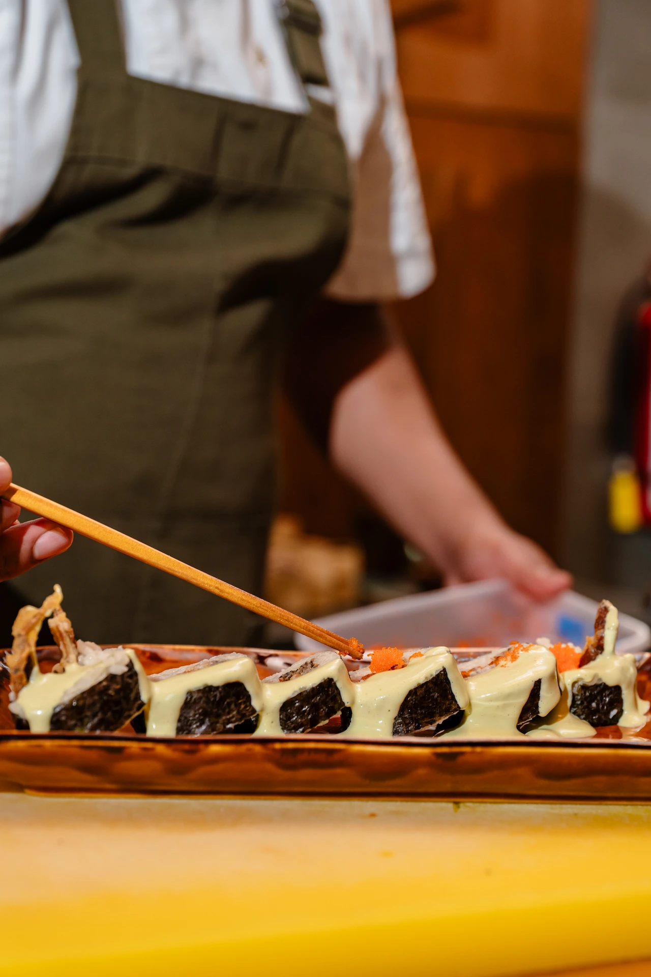 Chef serving sushi for dinner at Conrad Tulum Riviera Maya hotel