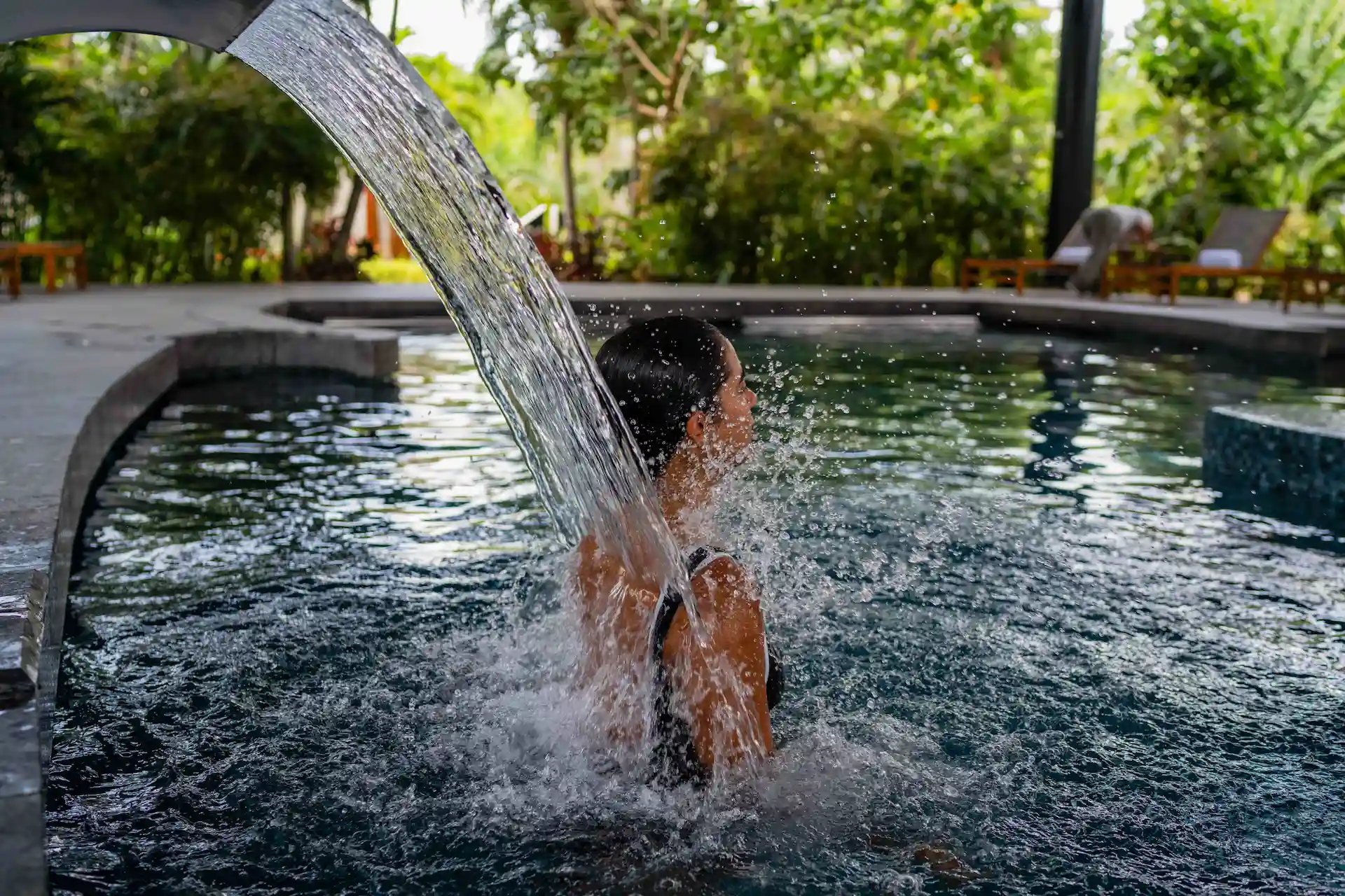 Woman enjoying the spa experience at Conrad Tulum Riviera Maya hotel.